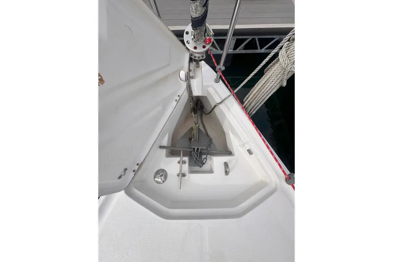 Slide: The Image of Anchor setup on a 2007 Hunter 27 sailboat, docked at a marina. - 16