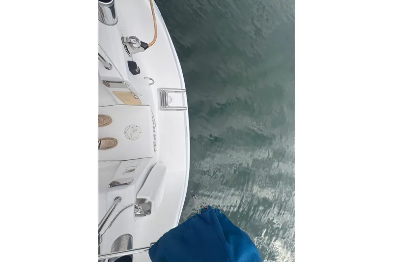 Slide: The Image of Deck view of a 2007 Hunter 27 sailboat on water, featuring nautical equipment. - 8