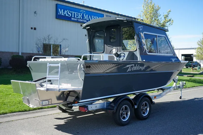 Slide: The Image of 2026 Weldcraft 210 Revolution boat on trailer at Master Marine Boat Center. - 3