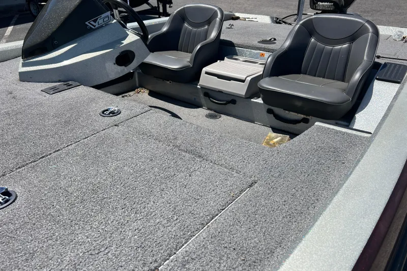 Slide: The Image of 2015 Stratos 186 VLO boat interior with dual seats and steering console. - 2