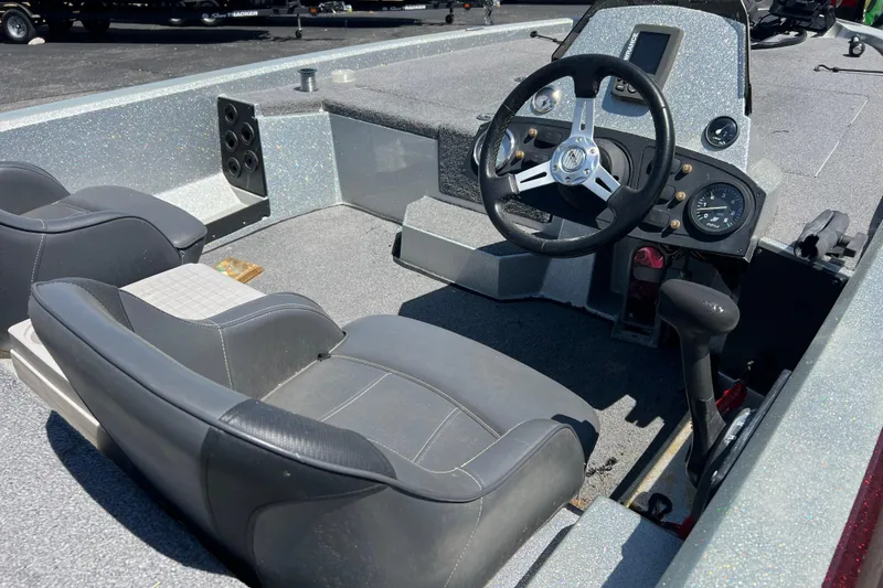 Slide: The Image of 2015 Stratos 186 VLO boat interior with steering wheel and seating. - 3