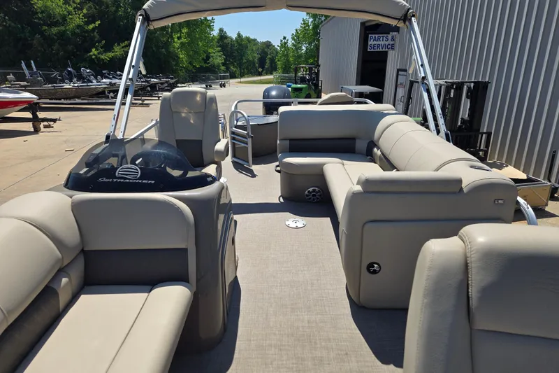 Slide: The Image of 2023 Sun Tracker SportFish 20 DLX pontoon boat with spacious seating and canopy. - 10