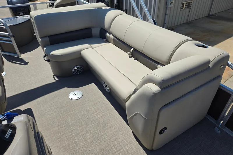 Slide: The Image of 2023 Sun Tracker SportFish 20 DLX pontoon boat with beige seating and spacious deck. - 14