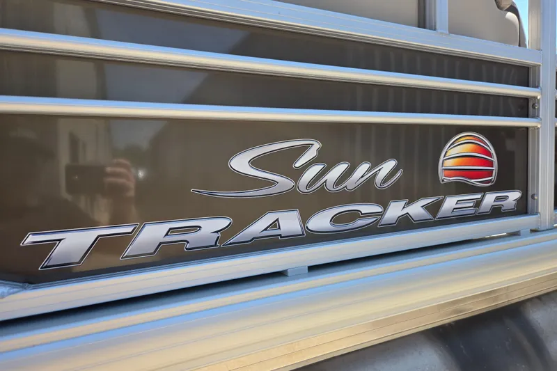 Slide: The Image of 2023 Sun Tracker SportFish 20 DLX logo on boat exterior. - 3