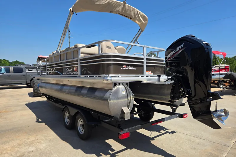 Slide: The Image of 2023 Sun Tracker SportFish 20 DLX pontoon boat with Mercury outboard motor on trailer. - 6