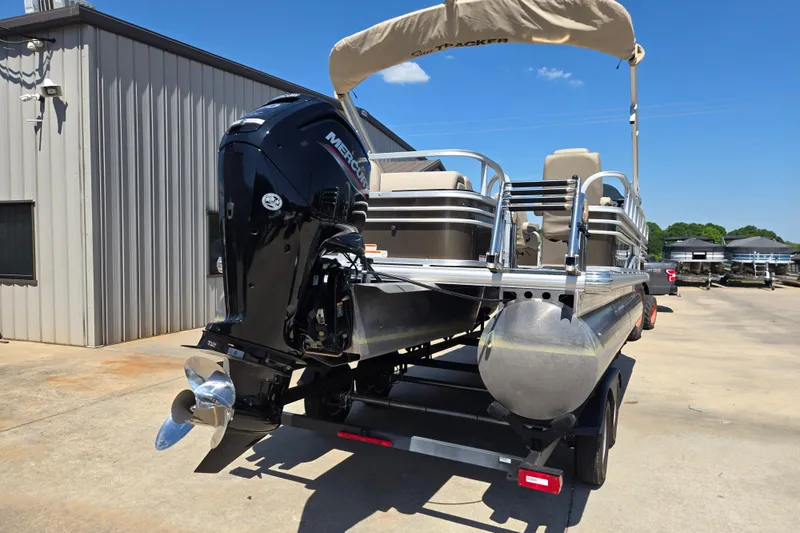 Slide: The Image of 2023 Sun Tracker SportFish 20 DLX pontoon boat with Mercury outboard motor. - 8