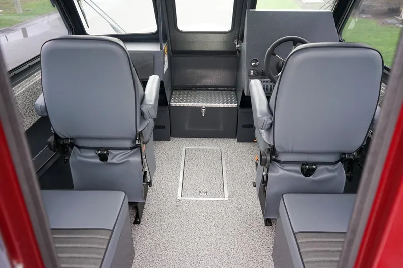 Slide: The Image of Interior of 2026 Alumaweld Intruder Outboard 22 boat with gray seating and steering console. - 12