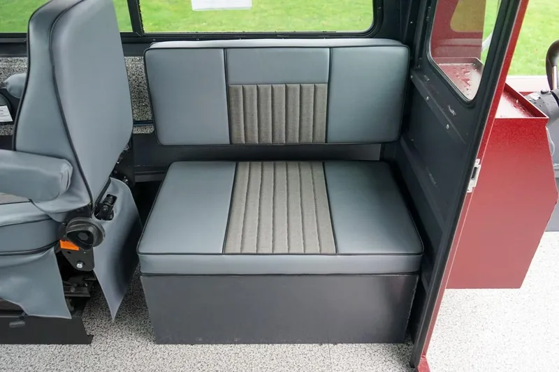 Slide: The Image of Interior seating of 2026 Alumaweld Intruder Outboard 22 boat, featuring gray upholstery. - 13
