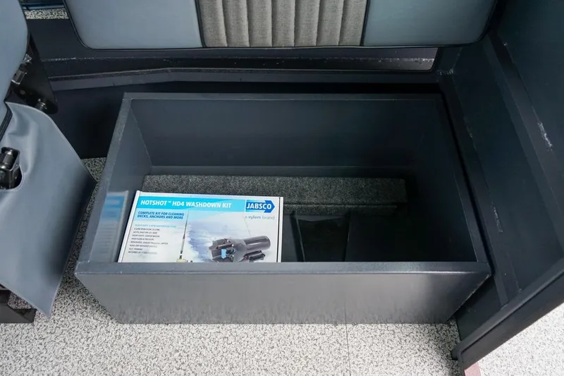 Slide: The Image of Storage compartment in 2026 Alumaweld Intruder Outboard 22 with Jabsco washdown kit. - 14