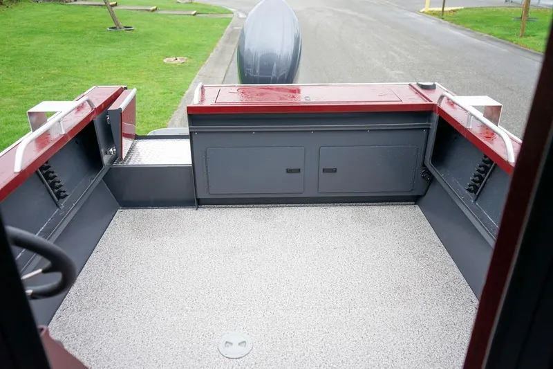Slide: The Image of 2026 Alumaweld Intruder Outboard 22 boat interior with spacious deck and storage compartments. - 7