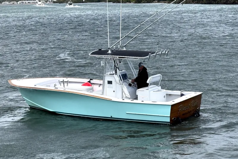 Slide: The Image of 1977 Scarborough 27 CC boat helm with steering wheel and control panel. - 10