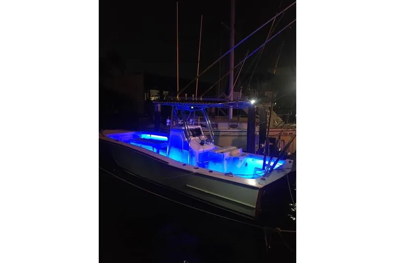 Slide: The Image of 1977 Scarborough 27 CC boat interior with white seating and a red buoy. - 16