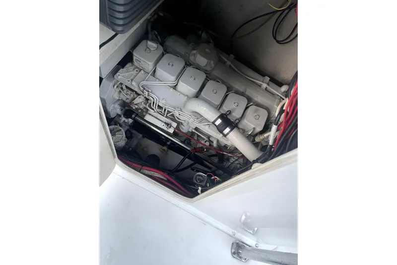 Slide: The Image of Bow view of a 1977 Scarborough 27 CC boat docked in a marina. - 18