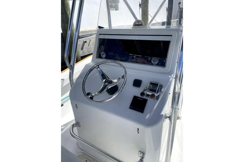 Slide: The Image of Aerial view of 1977 Scarborough 27 CC boat on dark water. - 2