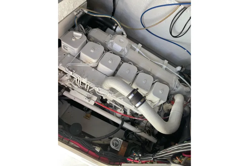 Slide: The Image of 1977 Scarborough 27 CC boat interior with speakers, docked at marina. - 20