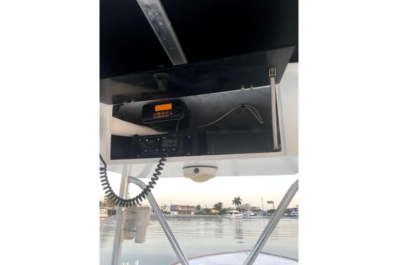 Slide: The Image of 1977 Scarborough 27 CC boat interior at dock, featuring clean white deck. - 5