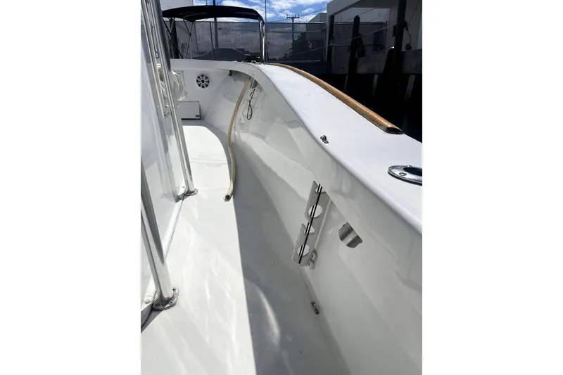 Slide: The Image of 1977 Scarborough 27 CC boat interior with white deck and storage compartments. - 6