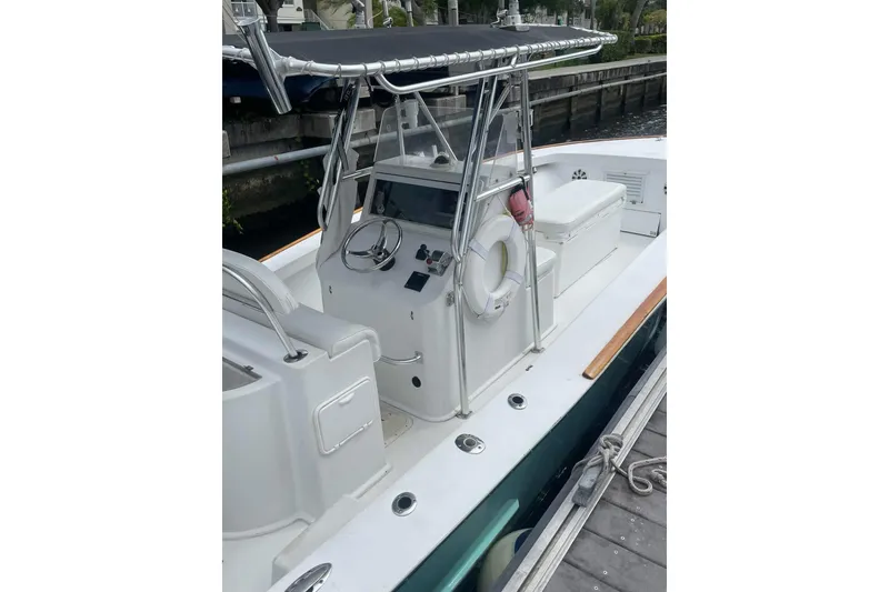 Slide: The Image of 1977 Scarborough 27 CC boat interior with steering wheel and controls. - 9