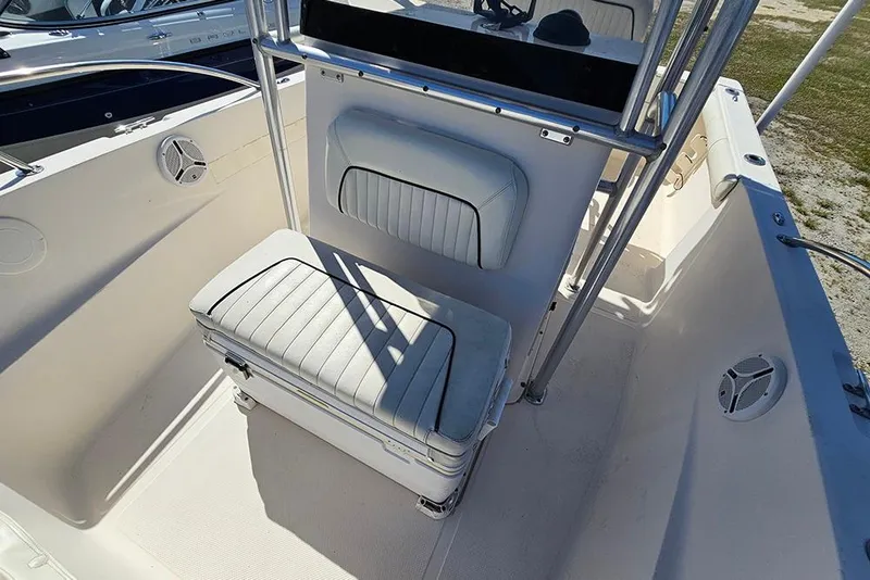 Slide: The Image of 2008 Key West 2020 Center Console boat interior with cushioned seating and speakers. - 17