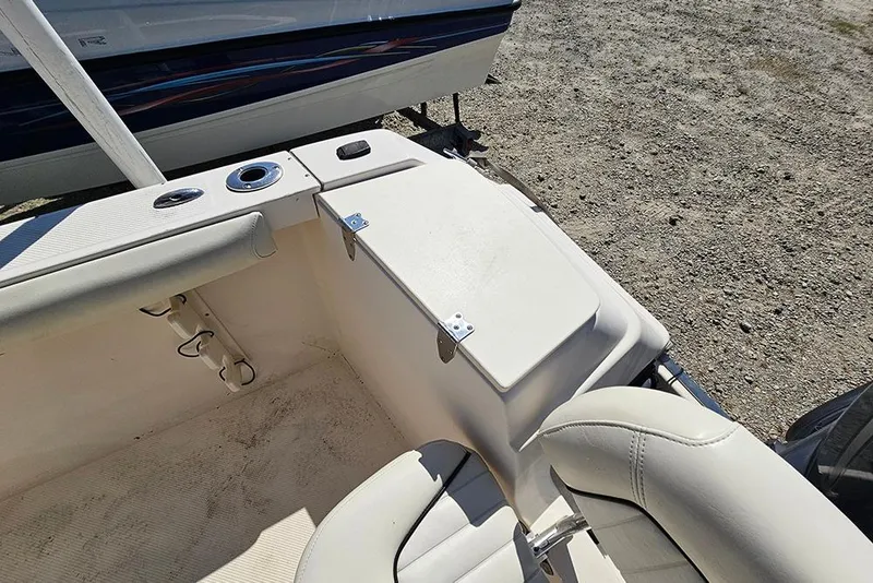 Slide: The Image of Interior of a 2008 Key West 2020 Center Console boat, featuring seating and storage. - 20