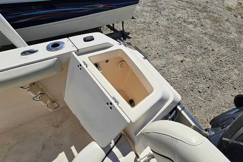 Slide: The Image of Open storage compartment on a 2008 Key West 2020 Center Console boat. - 21