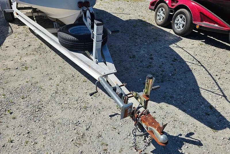 Slide: The Image of Trailer hitch of a 2008 Key West 2020 Center Console boat on gravel. - 5