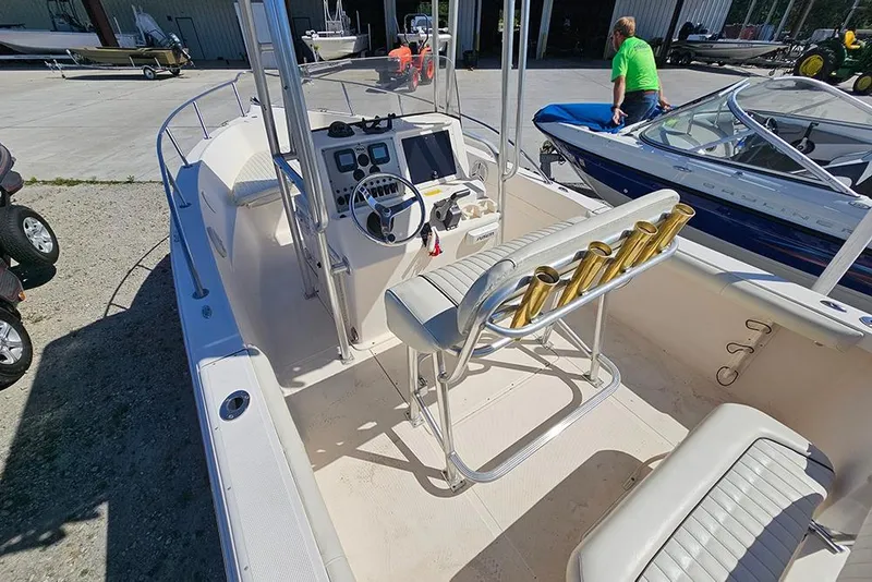 Slide: The Image of Key West 2020 Center Console boat, 2008 model, with steering and seating, docked outdoors. - 8