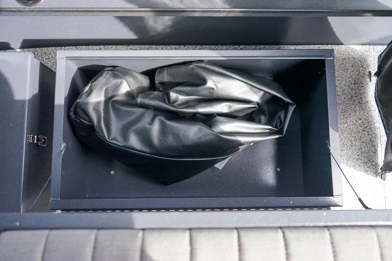 Slide: The Image of Storage compartment in 2026 Alumaweld Talon 18 boat with black cover inside. - 13
