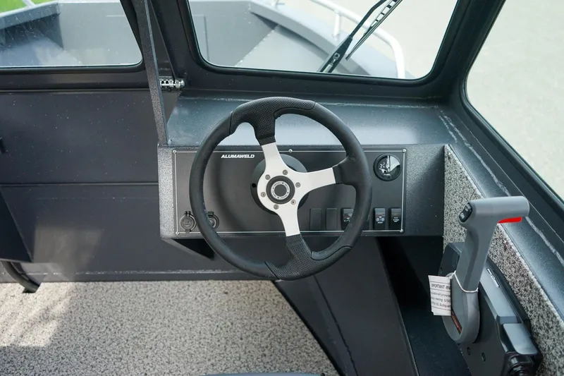 Slide: The Image of Steering console of 2026 Alumaweld Talon 18 boat with modern controls. - 15