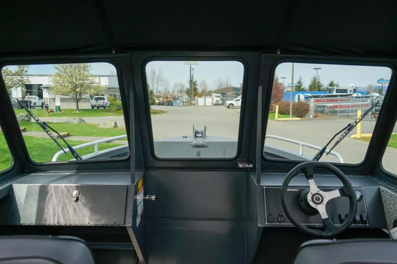 Slide: The Image of Interior view of 2026 Alumaweld Talon 18 boat cockpit with steering wheel. - 18
