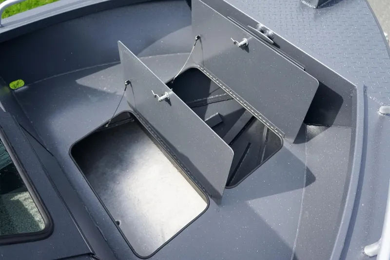 Slide: The Image of Storage compartments on a 2026 Alumaweld Talon 18 boat, open and ready for use. - 20