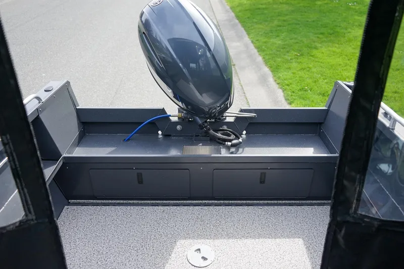 Slide: The Image of 2026 Alumaweld Talon 18 boat with outboard motor, viewed from the interior. - 6