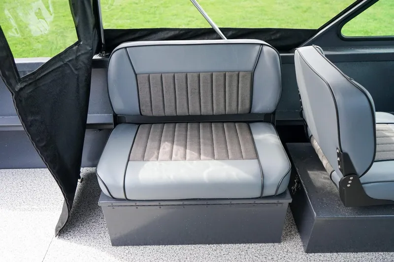 Slide: The Image of Interior seating of 2026 Alumaweld Talon 18 boat, featuring gray cushioned seats. - 9