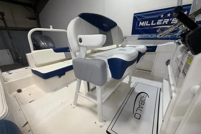 Slide: The Image of 2026 Robalo R222 Explorer boat interior with cushioned seating and branded mat. - 10