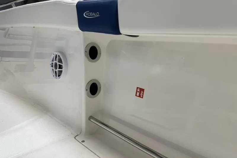 Slide: The Image of 2026 Robalo R222 Explorer boat interior with speaker and rod holders. - 13