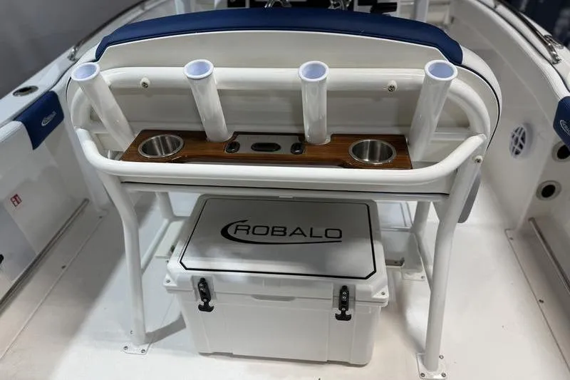 Slide: The Image of 2026 Robalo R222 Explorer boat console with rod holders and cooler. - 15