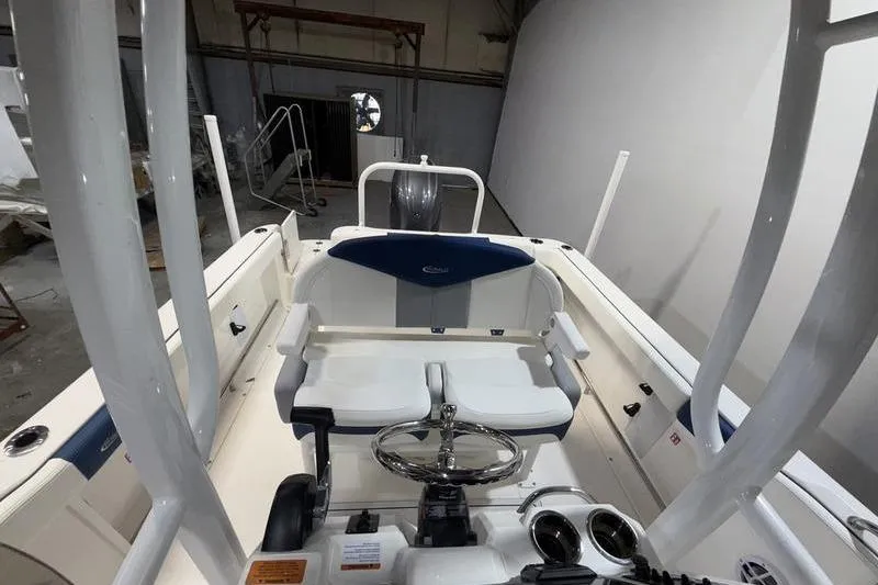 Slide: The Image of 2026 Robalo R222 Explorer boat interior with steering wheel and seating. - 18
