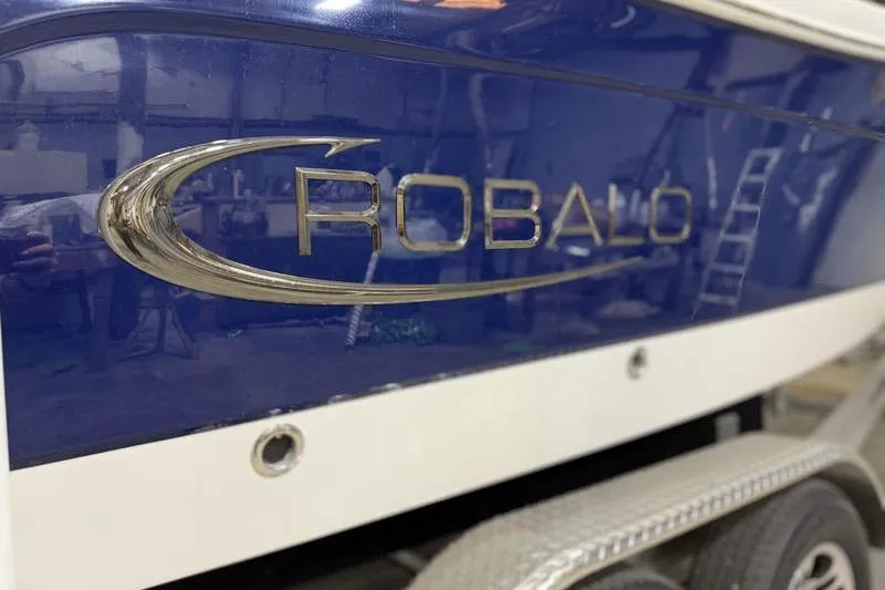 Slide: The Image of 2026 Robalo R222 Explorer boat with blue and white exterior detailing. - 5