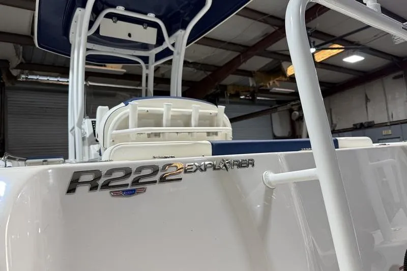 Slide: The Image of 2026 Robalo R222 Explorer boat in a warehouse setting. - 6
