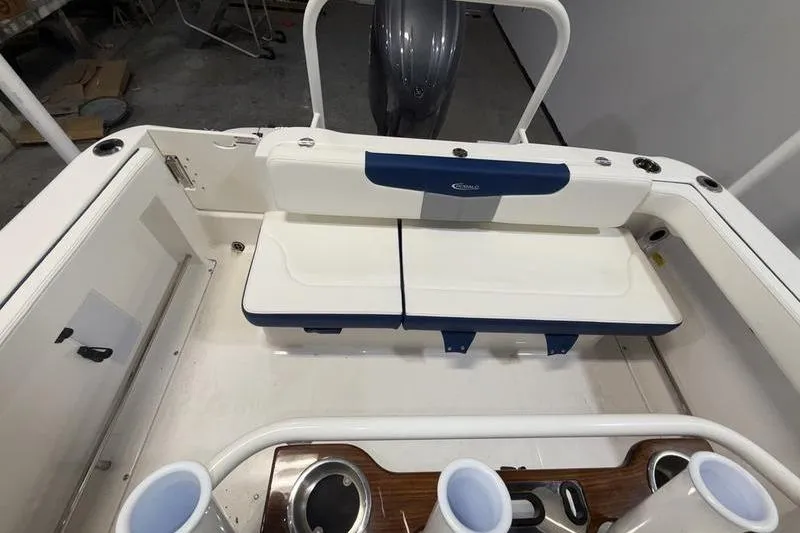 Slide: The Image of 2026 Robalo R222 Explorer boat interior with seating and cup holders. - 7