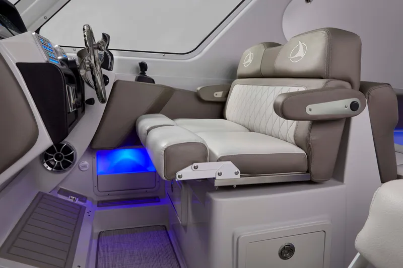 Slide: The Image of 2024 Crownline 280 DC Finseeker helm with luxurious seating and modern dashboard design. - 10