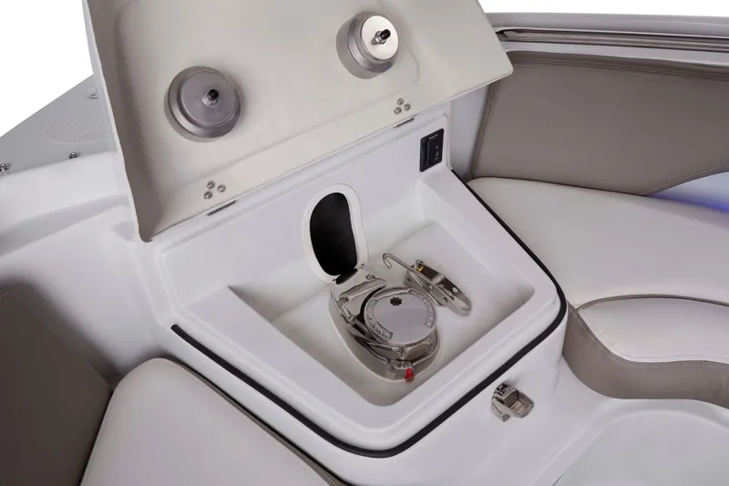 Slide: The Image of 2024 Crownline 280 DC Finseeker boat interior detail with storage compartment and seating. - 13