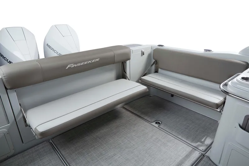Slide: The Image of 2024 Crownline 280 DC Finseeker boat interior with cushioned seating and dual Mercury engines. - 6