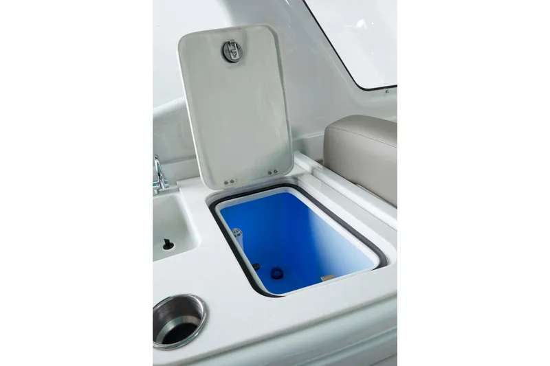 Slide: The Image of Open storage compartment on 2024 Crownline 280 DC Finseeker boat, featuring sleek design. - 8