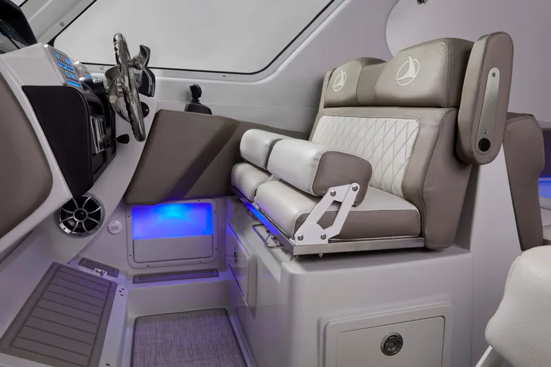 Slide: The Image of 2024 Crownline 280 DC Finseeker helm with luxurious seating and modern controls. - 9