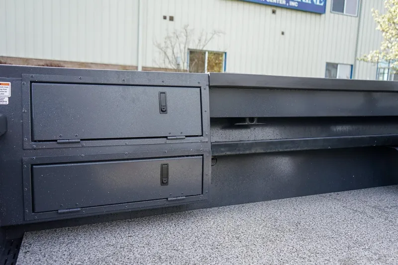 Slide: The Image of 2026 Alumaweld Super Vee Pro 21 storage compartments on a textured boat deck. - 10