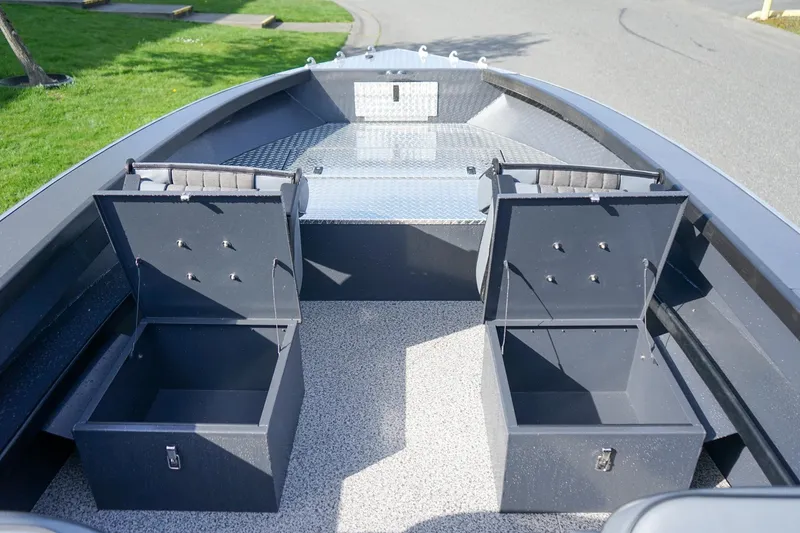 Slide: The Image of 2026 Alumaweld Super Vee Pro 21 boat interior with open storage compartments. - 13