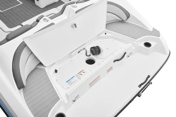Slide: The Image of 2026 Yamaha Boats SX190 storage compartment with open hatch, showcasing spacious interior design. - 15