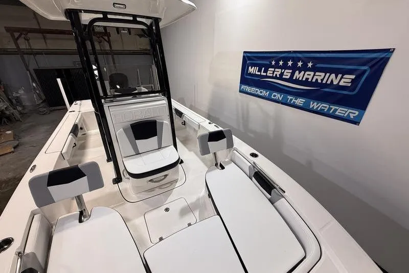 Slide: The Image of 2026 Robalo 226 Cayman boat interior at Miller's Marine showroom. - 16