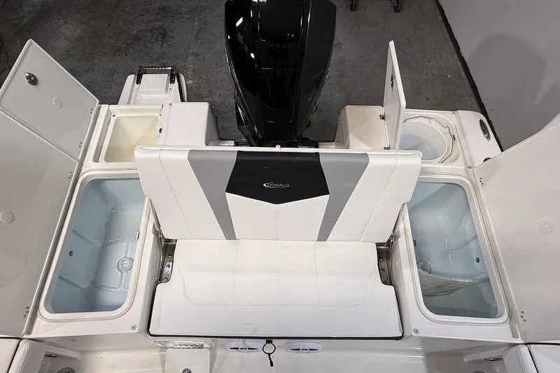 Slide: The Image of 2026 Robalo 226 Cayman boat interior with storage compartments and seating. - 6